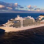 Cruise planning guide featuring a modern cruise ship at sea